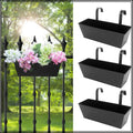 Balcony railing planter box set mounted on a railing with flowers